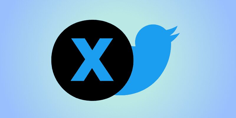 Elon Musk revealing the new 'X' logo for Twitter.