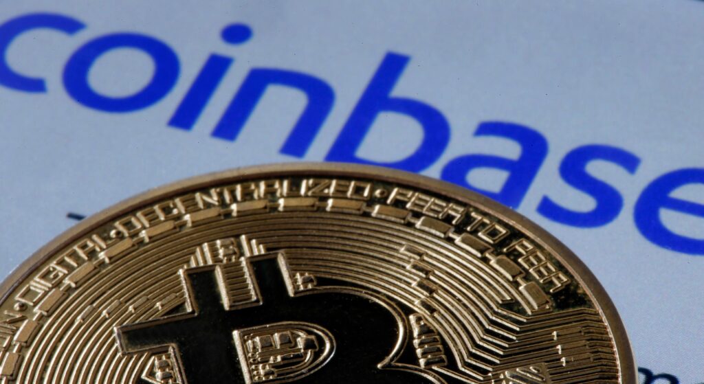 Coinbase logo with a backdrop of numerous Bitcoins.